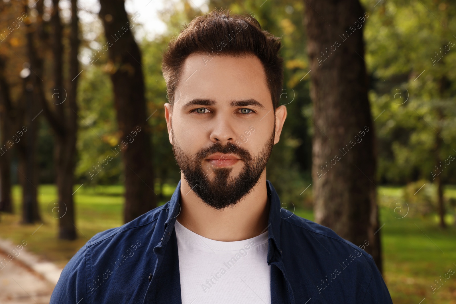 Photo of Portrait of handsome young man in park