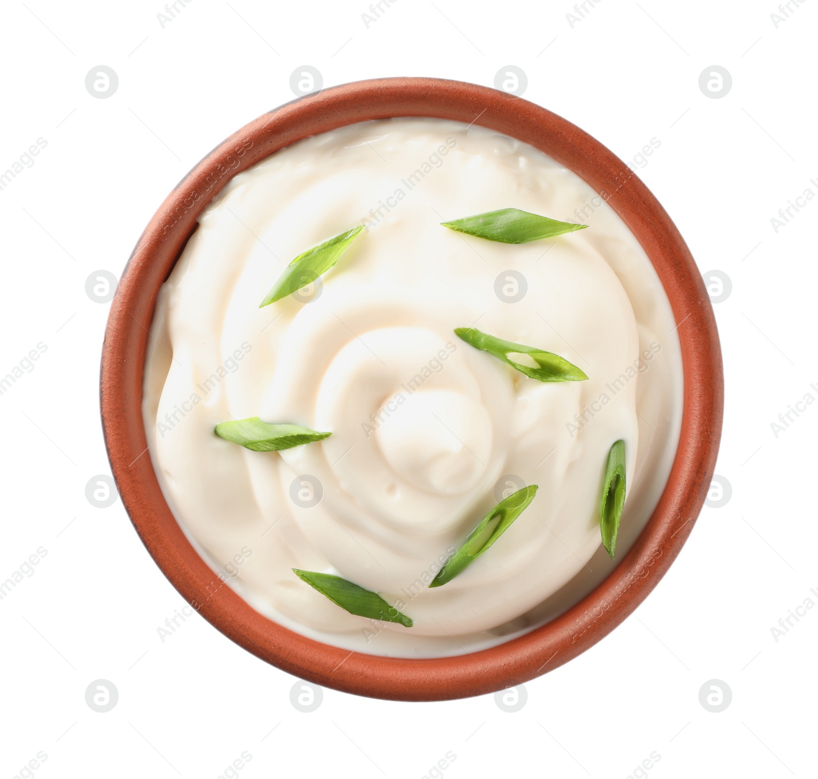 Photo of Mayonnaise with green onion in bowl isolated on white, top view