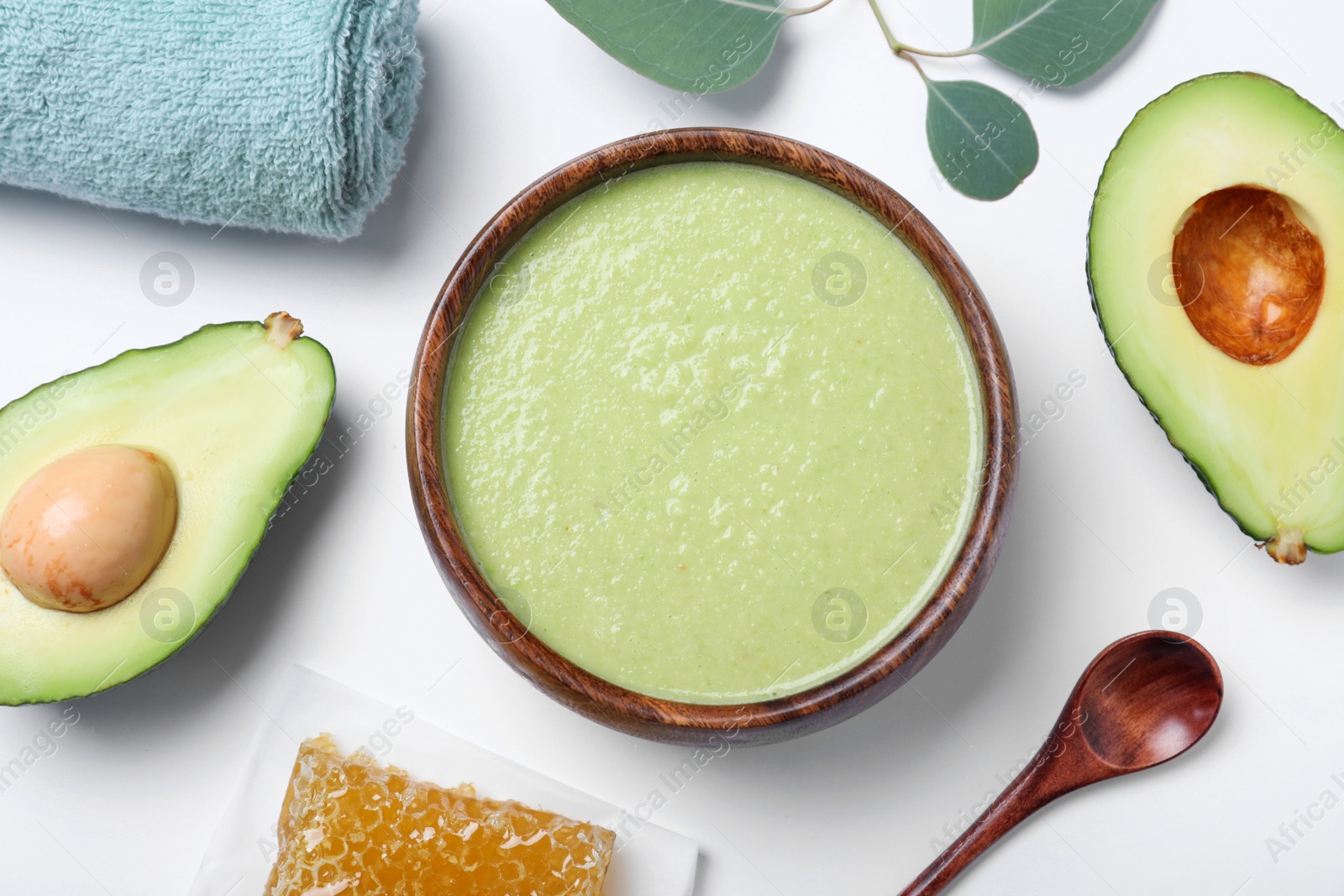 Photo of Homemade hair mask, towel and ingredients on white background, flat lay