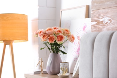 Vase with beautiful flowers in modern room interior