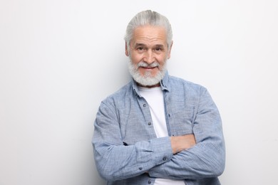 Portrait of handsome senior man on white background