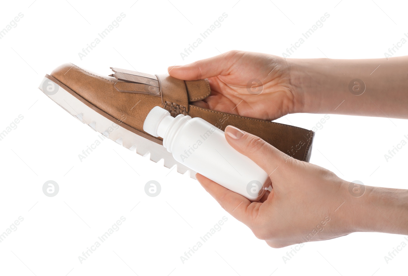 Photo of Woman cleaning stylish footwear on white background, closeup. Shoe care accessories