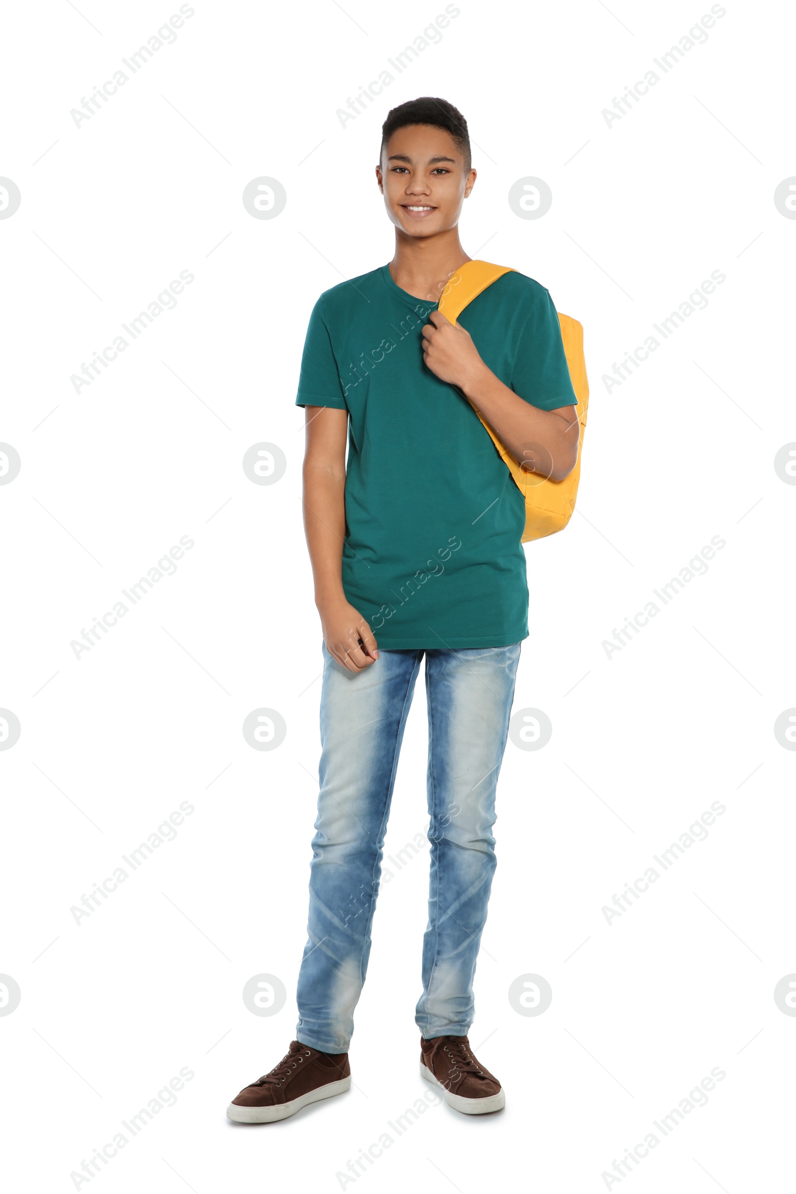 Photo of African-American teenager boy in casual clothes on white background