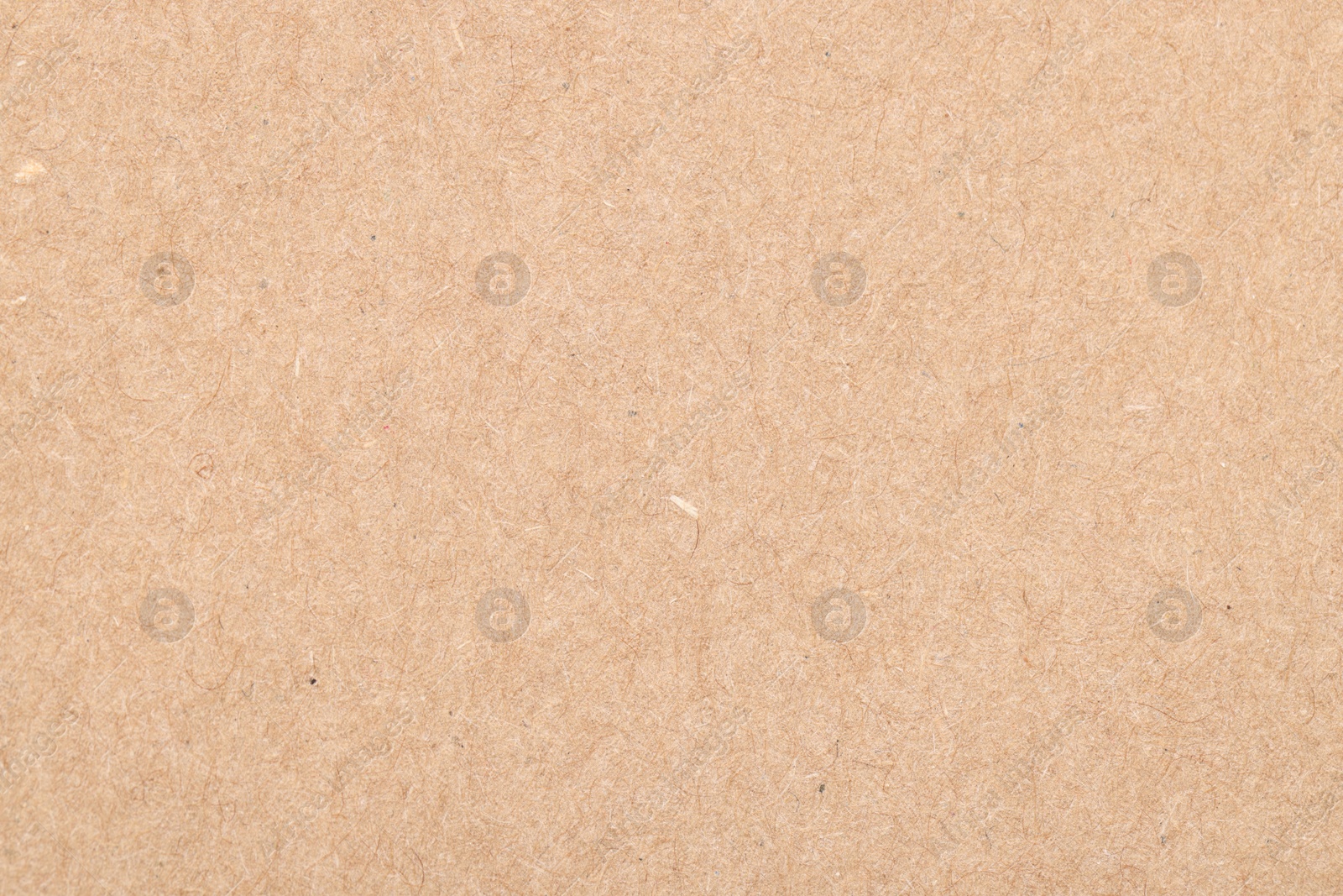 Photo of Texture of beige paper sheet as background, top view