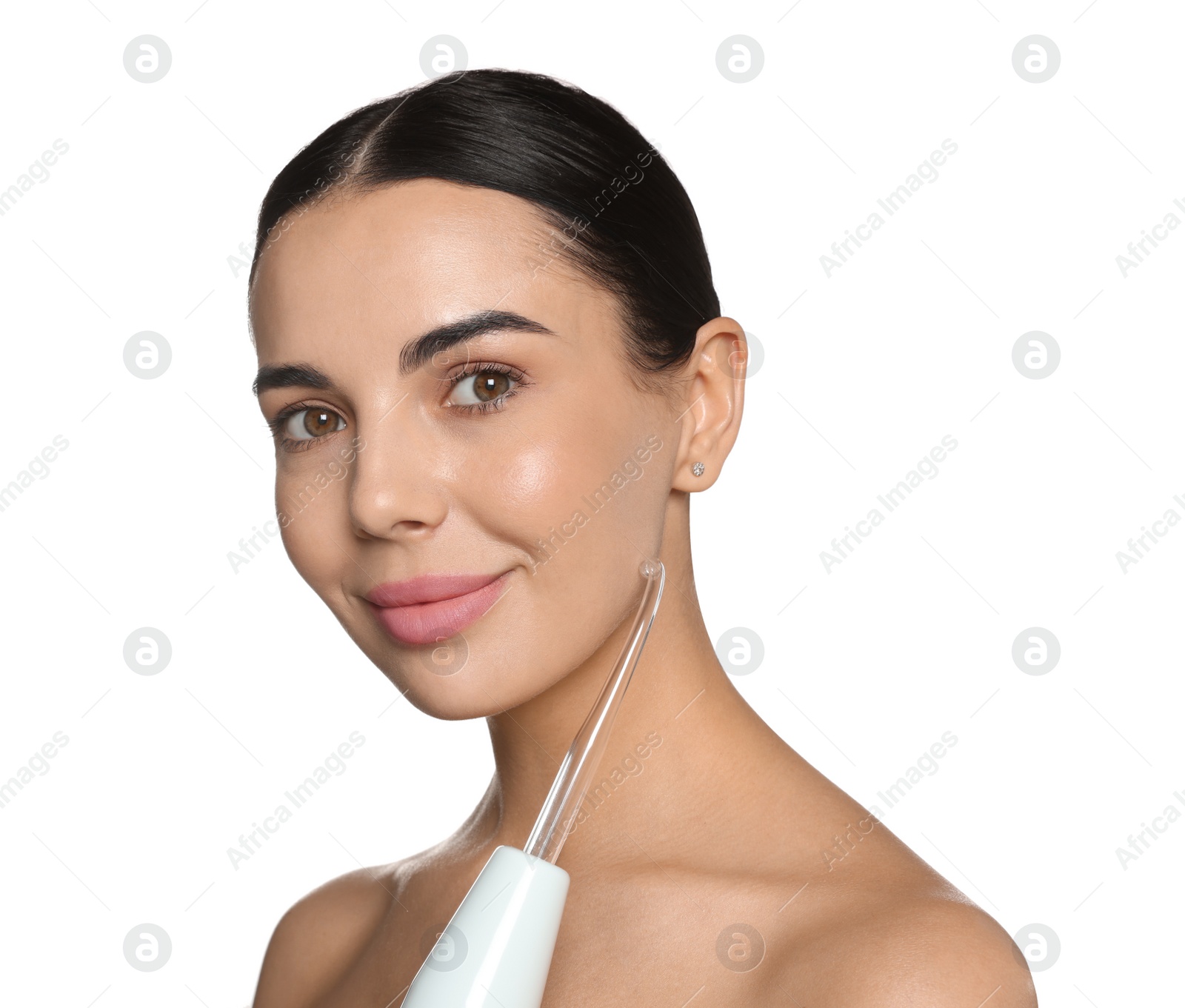 Photo of Woman using high frequency darsonval device on white background