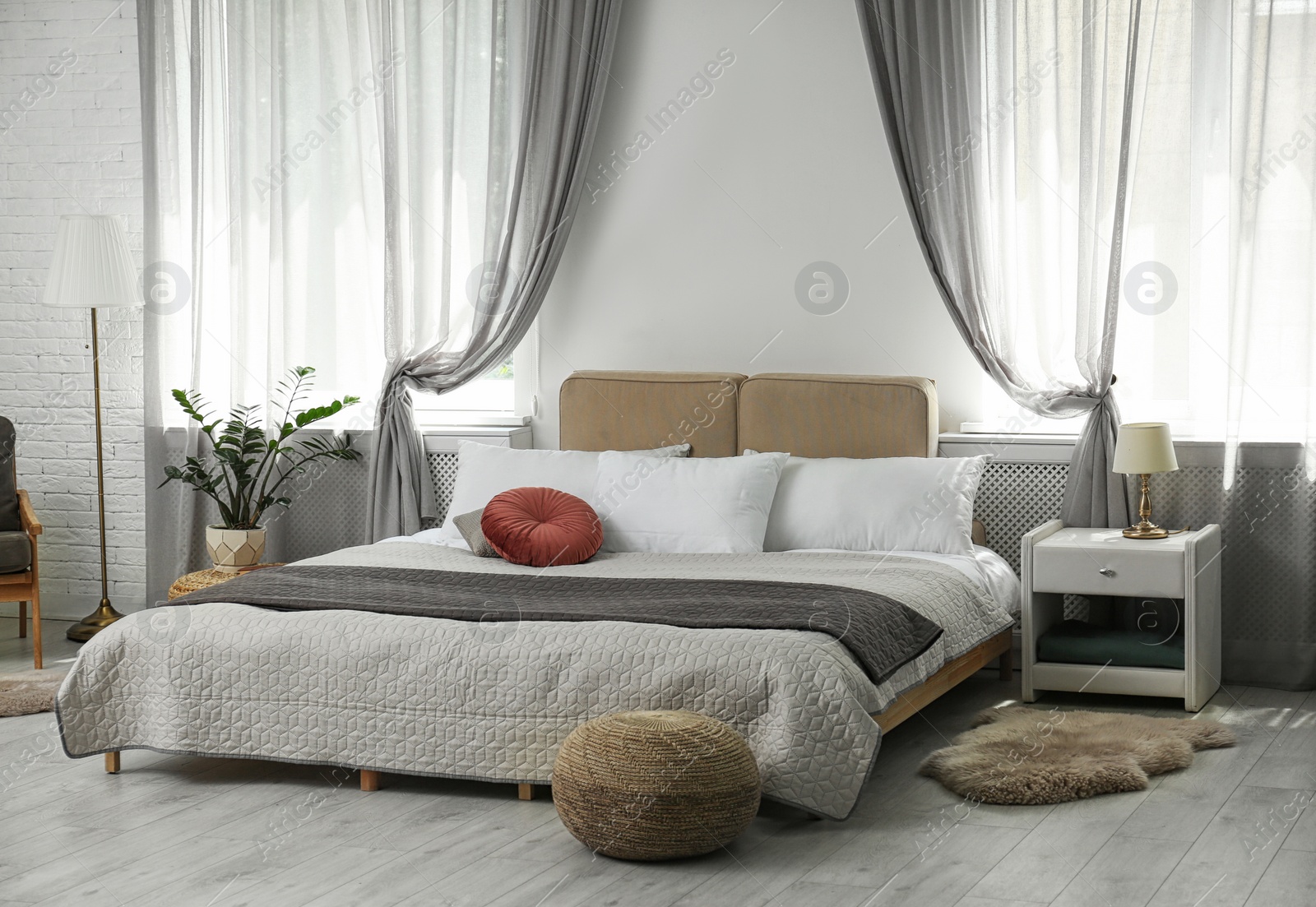 Photo of Stylish modern bedroom with decorative elements. Idea for interior design