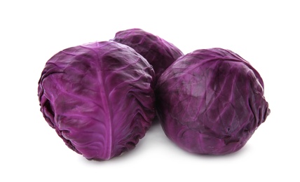 Photo of Whole ripe red cabbages on white background