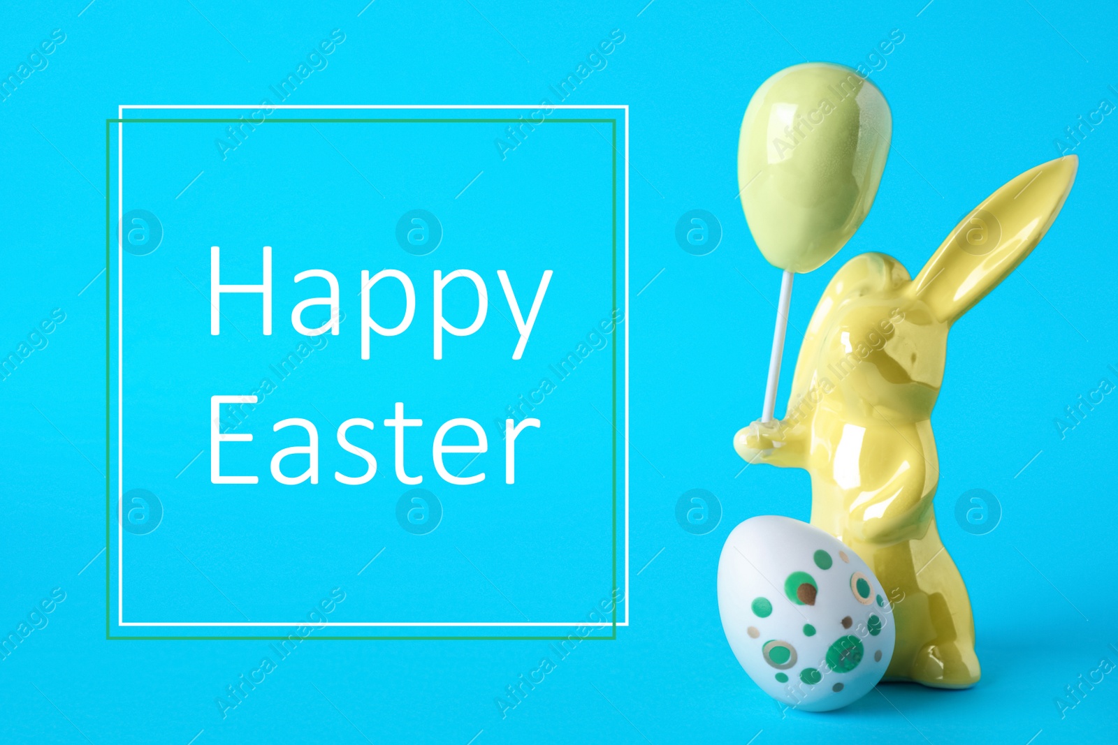 Image of Easter bunny figure and egg on blue background