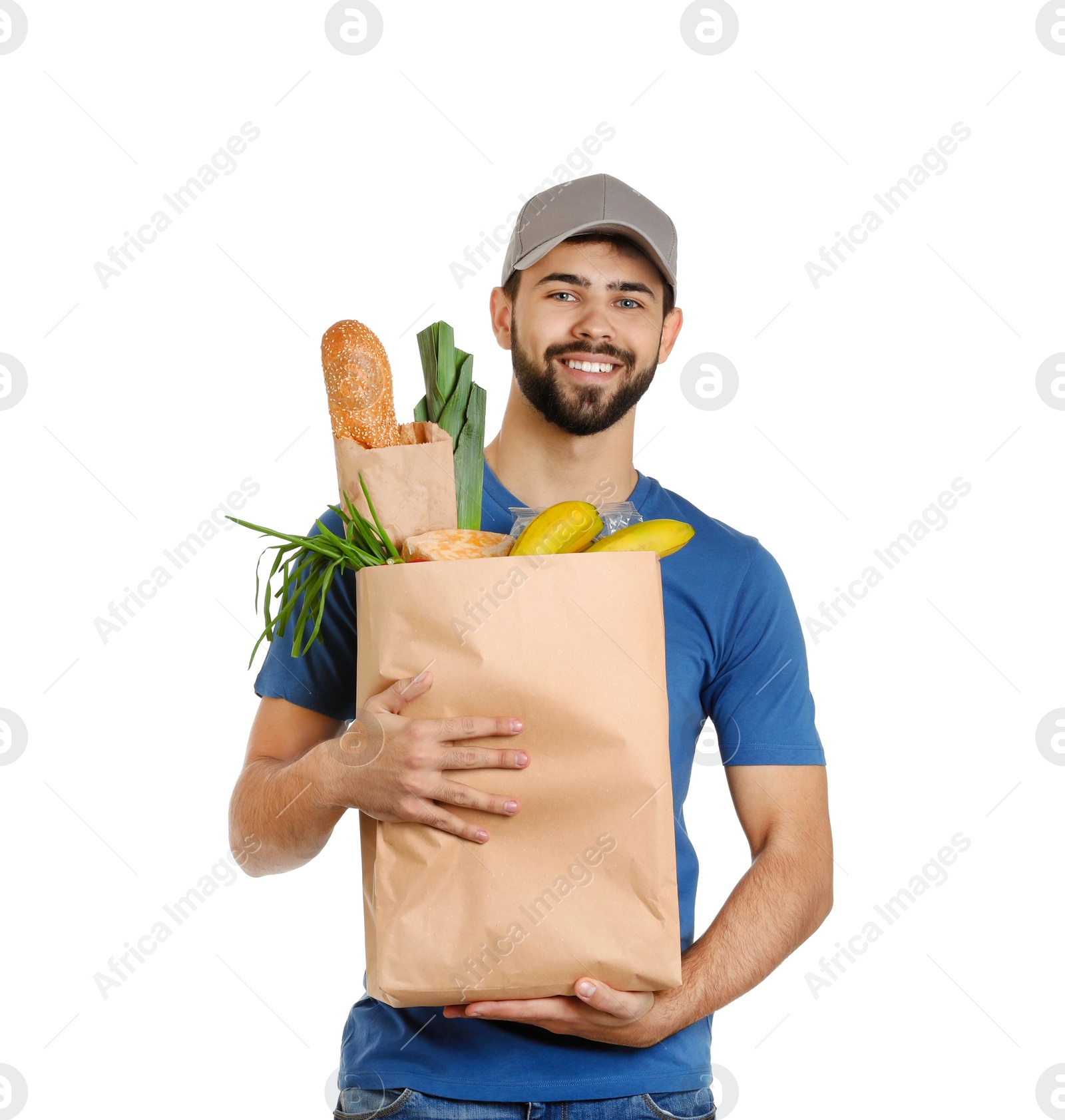 Photo of Man holding paper bag with fresh products on white background. Food delivery service