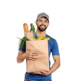 Man holding paper bag with fresh products on white background. Food delivery service