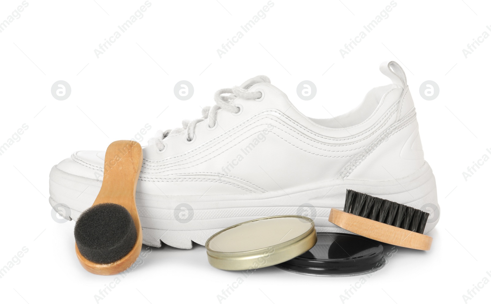 Photo of Composition with stylish footwear and shoe care accessories on white background