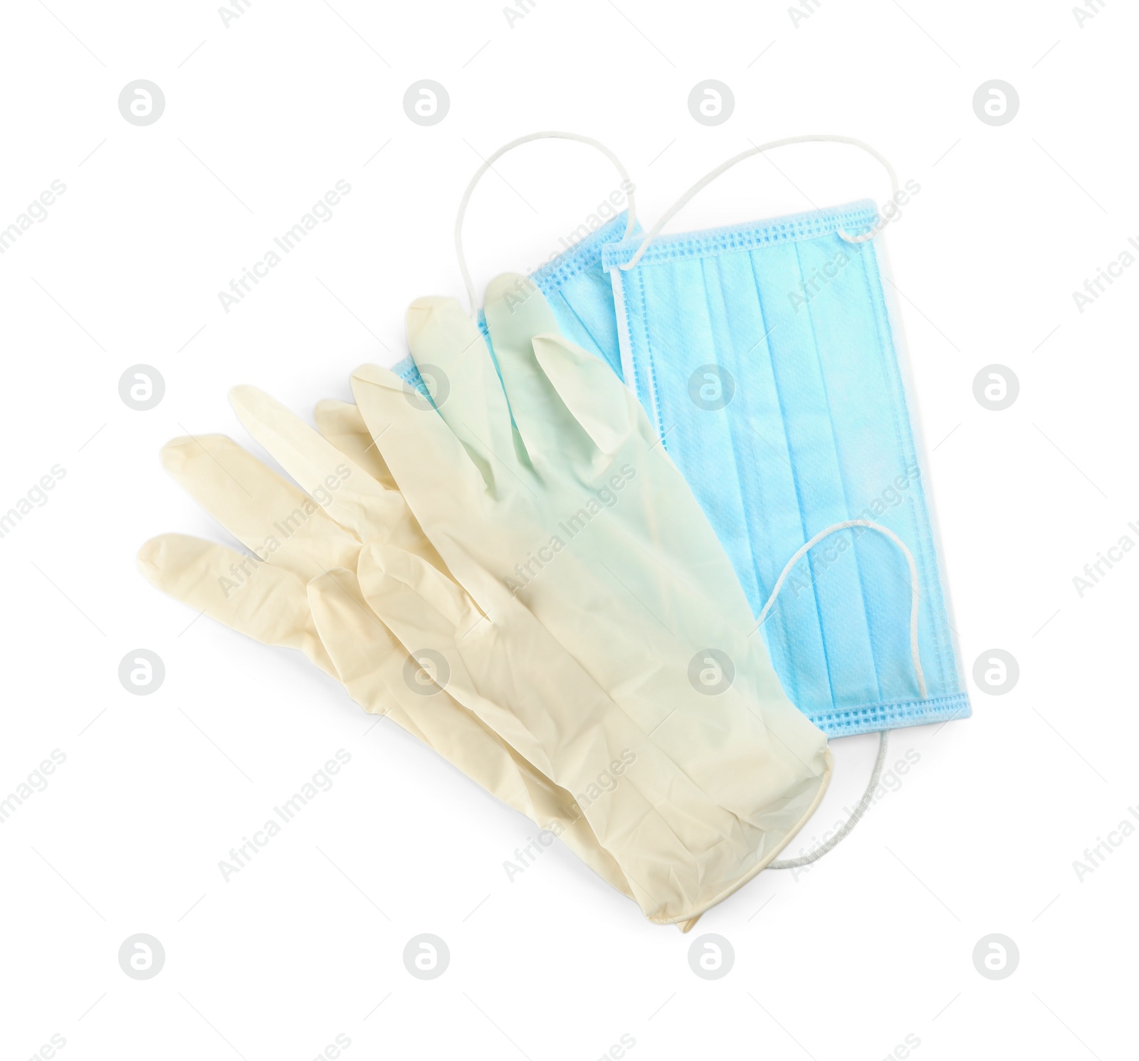 Photo of Medical gloves and protective face masks on white background, top view