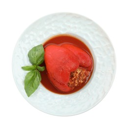 Photo of Delicious stuffed pepper with basil in bowl isolated on white, top view