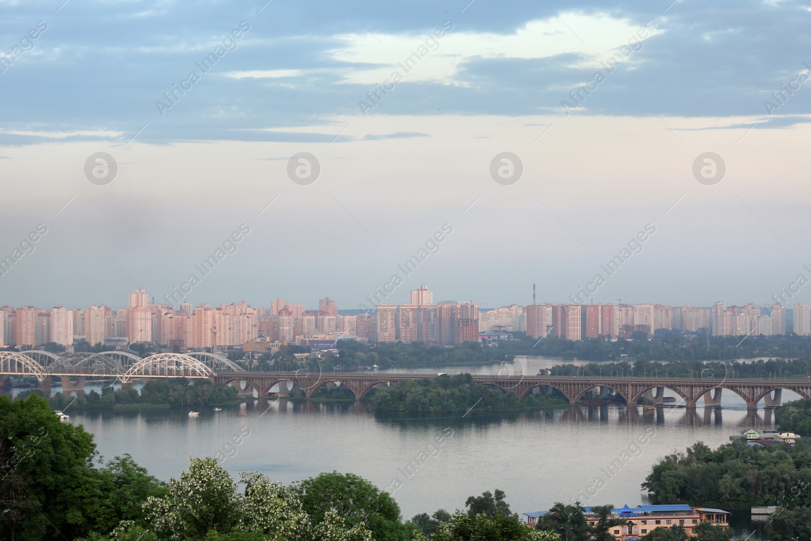 Photo of KYIV, UKRAINE - MAY 23, 2019: Beautiful view of Darnitsky railway bridge over Dnipro river