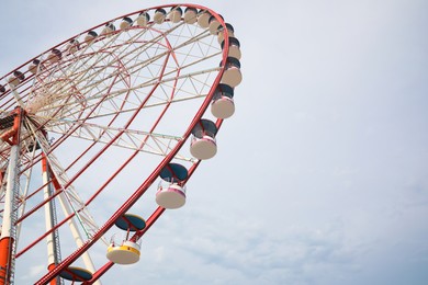 Beautiful large Ferris wheel outdoors, low angle view