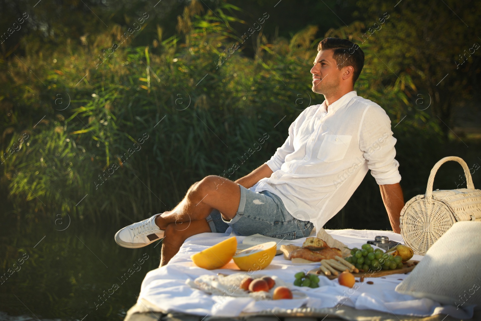 Photo of Man spending time on pier at picnic