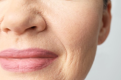 Beautiful older woman, closeup of lips