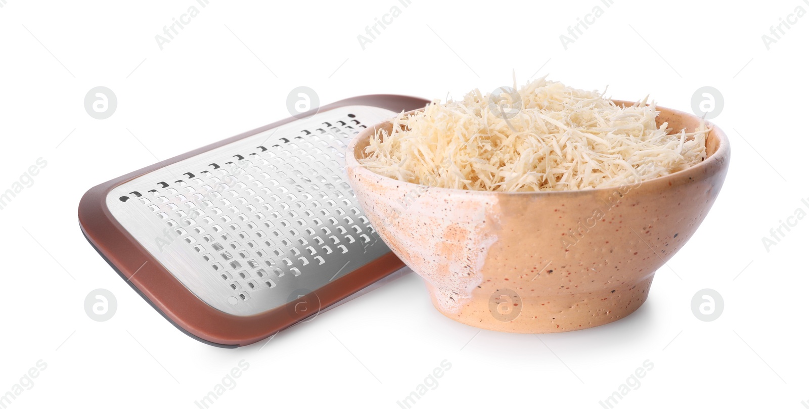 Photo of Grated horseradish in bowl and hand grater isolated on white