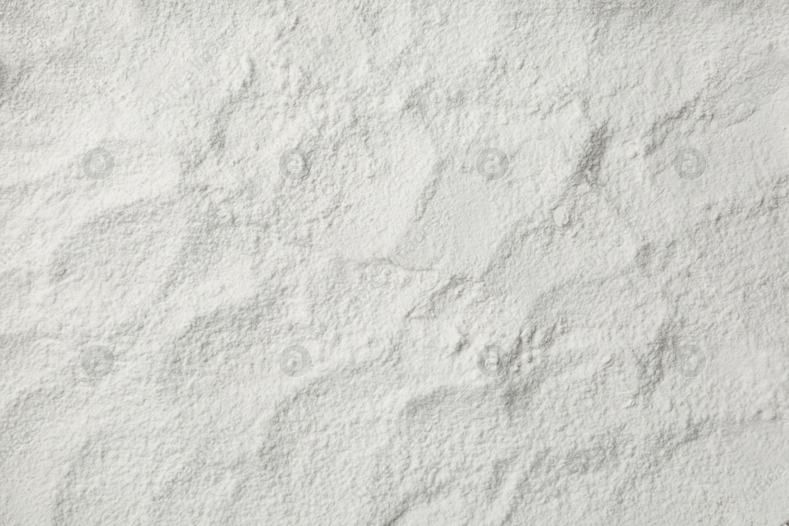 Photo of Pile of organic flour as background, top view