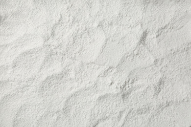 Photo of Pile of organic flour as background, top view