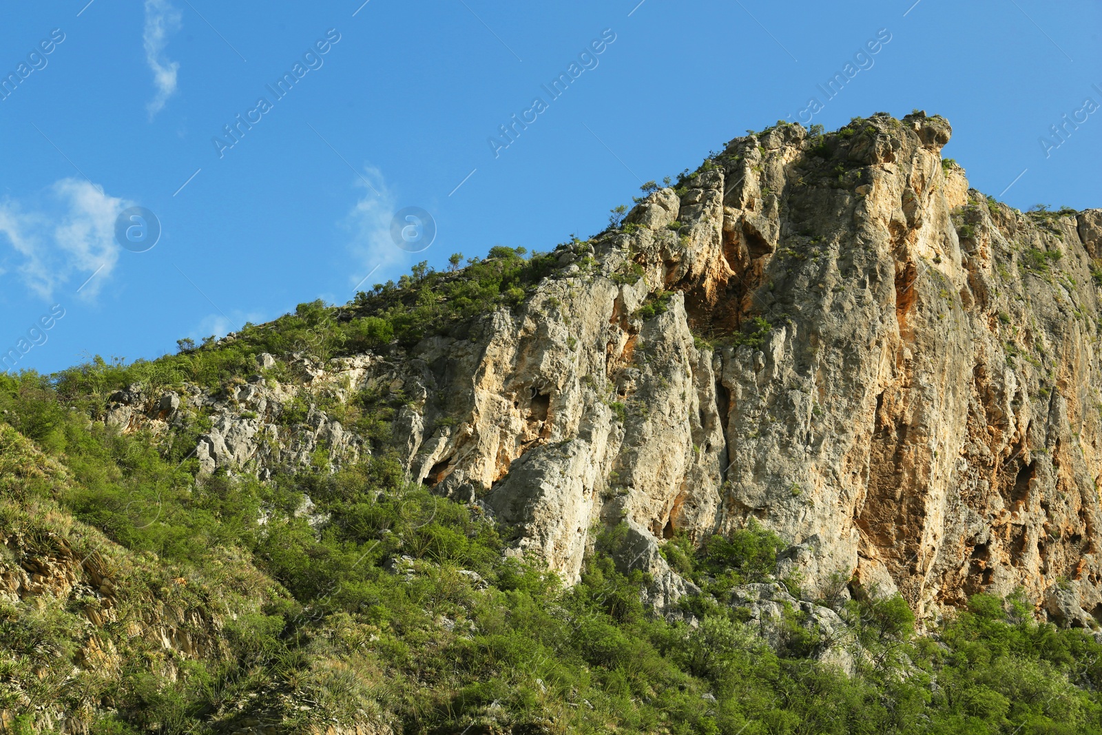 Photo of Picturesque landscape with high mountains under blue sky outdoors
