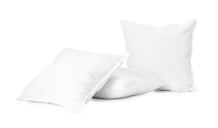 Photo of Three new soft pillows isolated on white