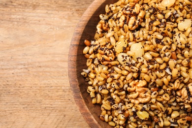 Photo of Traditional Christmas slavic dish kutia on wooden table, top view