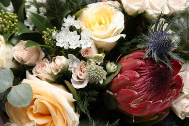 Photo of Beautiful bouquet with roses as background, closeup