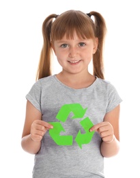 Photo of Little girl with recycling symbol on white background