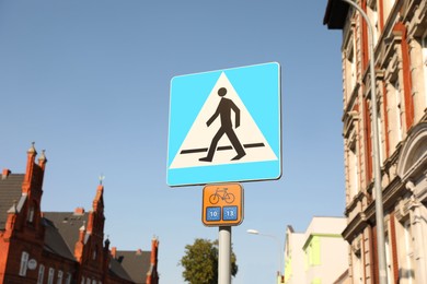 Photo of Traffic signs Pedestrian Crossing and Bicycle Route Information on city street