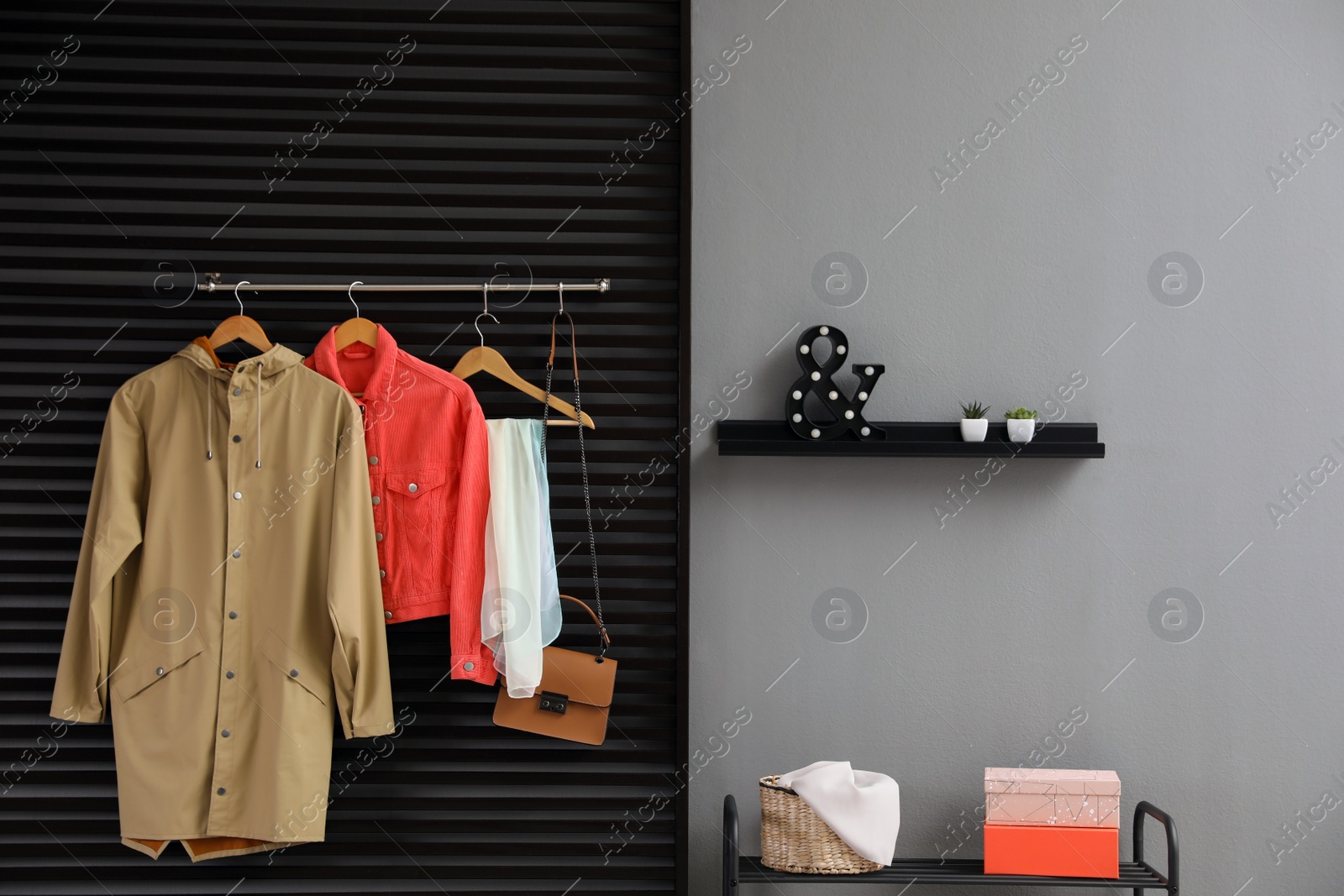 Photo of Hallway interior with stylish furniture, clothes and accessories