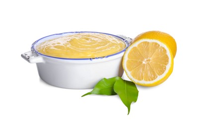 Delicious lemon curd in bowl, fresh citrus fruits and green leaves isolated on white