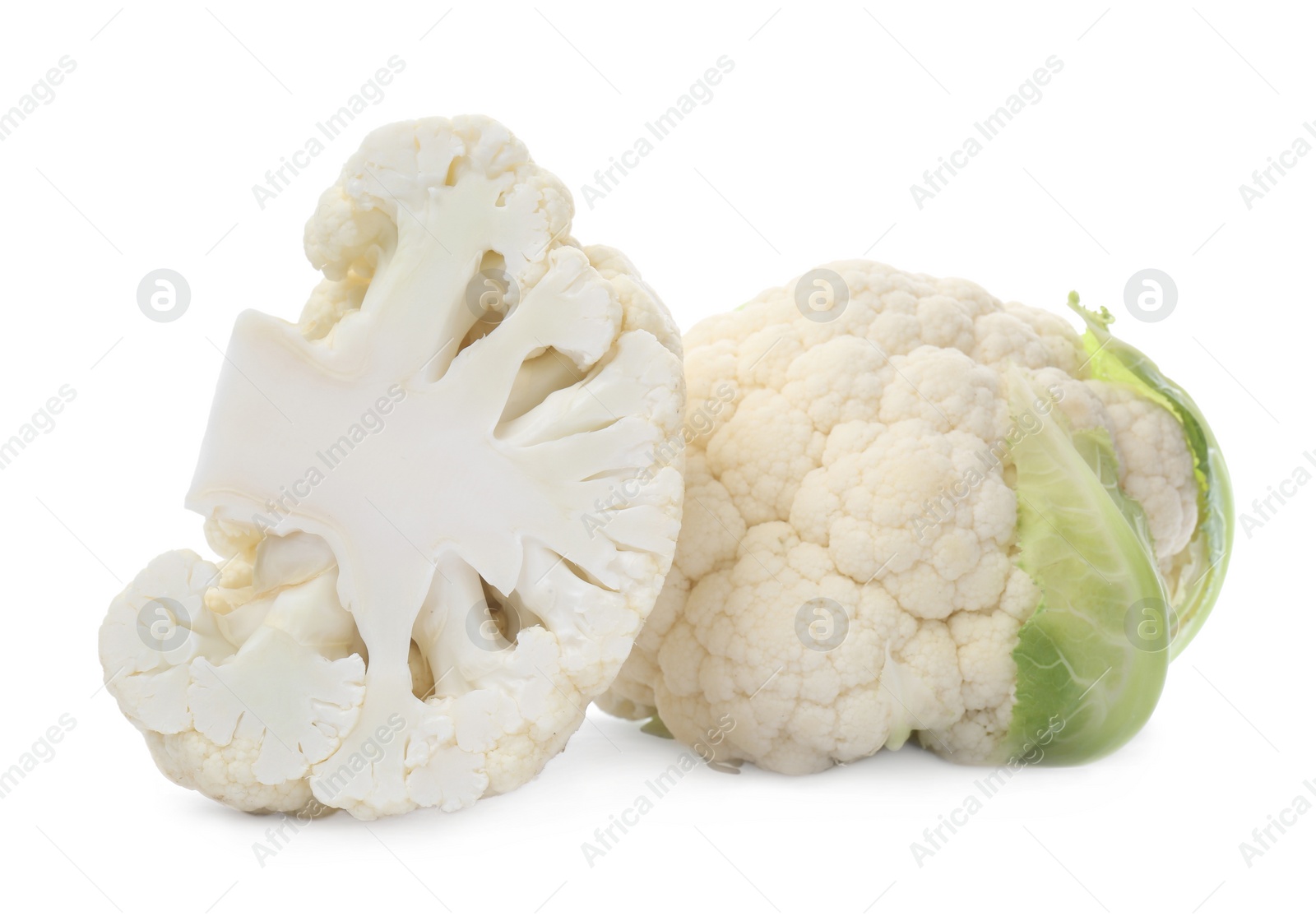 Photo of Cut and whole cauliflowers on white background