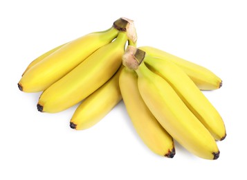 Photo of Clusters of ripe baby bananas on white background