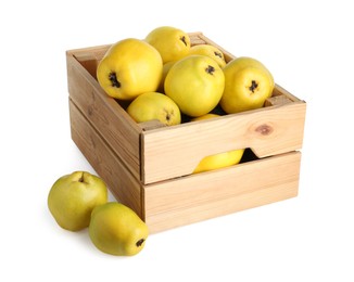 Photo of Wooden crate with delicious fresh ripe quinces isolated on white