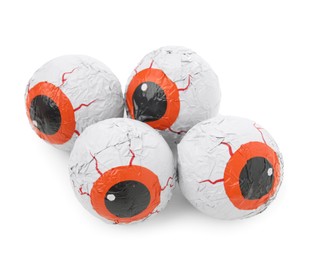 Delicious colorful candies in shape of eyes on white background. Halloween sweets