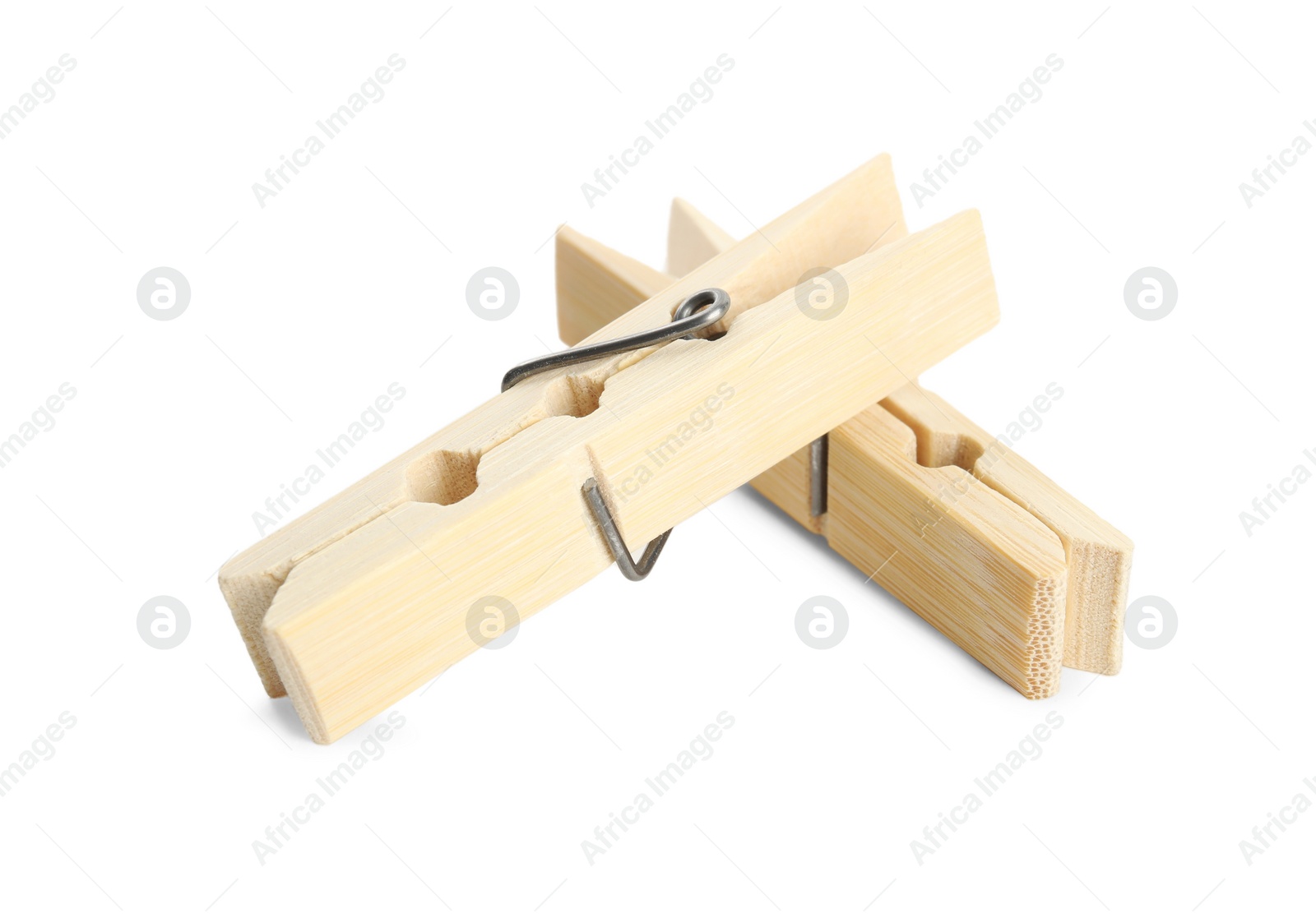 Photo of Two classic wooden clothespins on white background