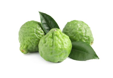 Photo of Fresh ripe bergamot fruits and leaves on white background
