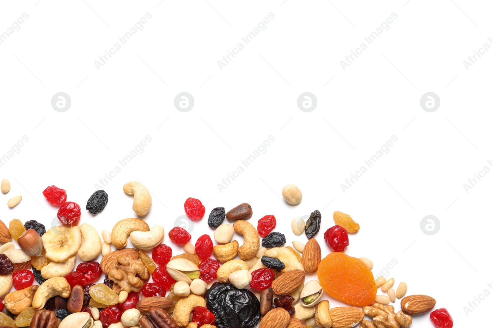 Photo of Different dried fruits and nuts on white background, top view. Space for text