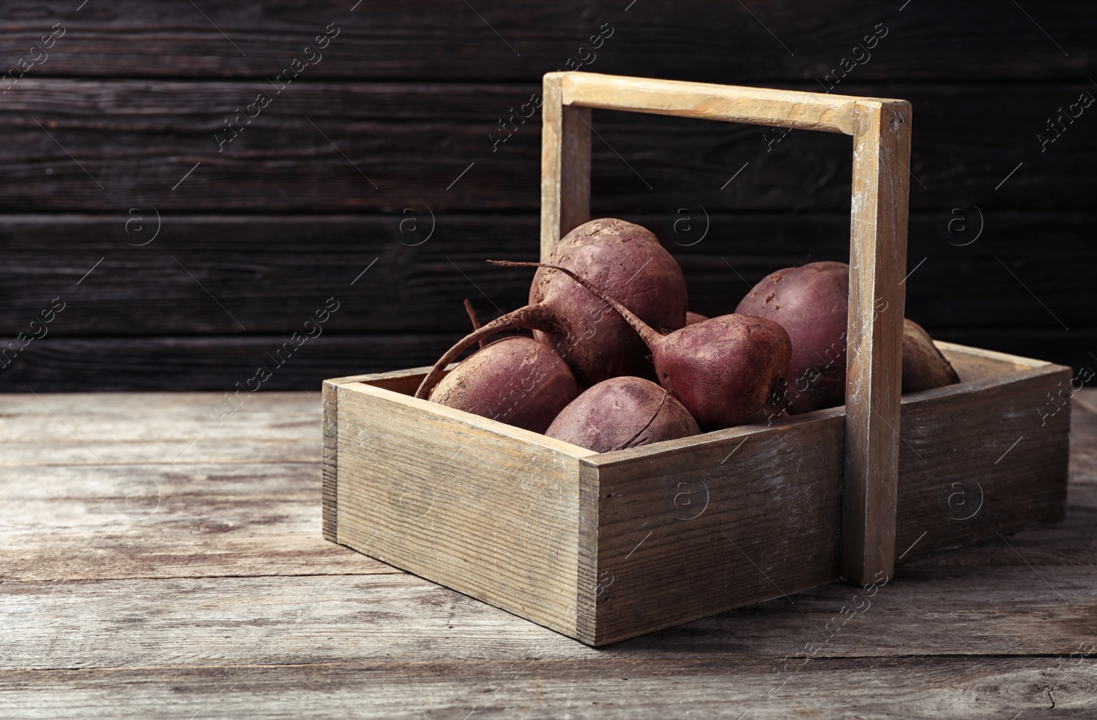 Photo of Box with whole fresh beets on wooden table