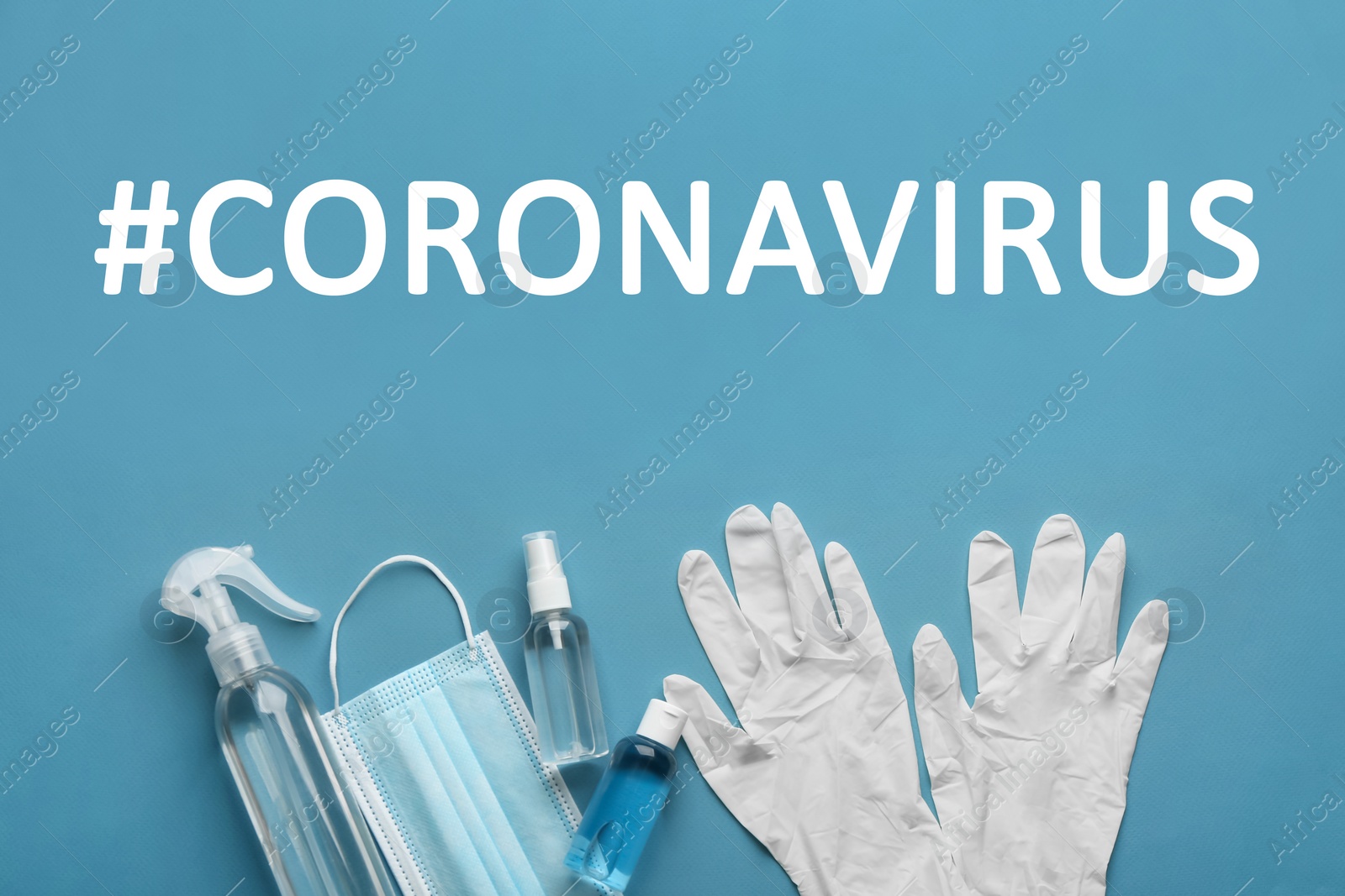 Image of Hashtag Coronavirus, medical gloves, protective mask and hand sanitizers on light blue background, flat lay