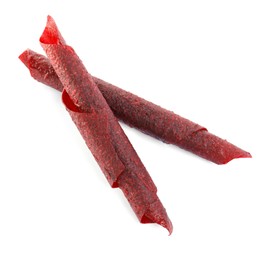 Photo of Delicious fruit leather rolls on white background, top view