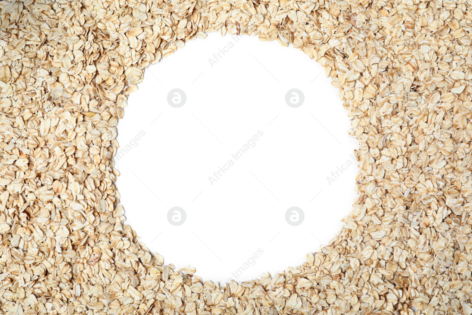 Photo of Frame of raw oatmeal on white background, top view. Space for text