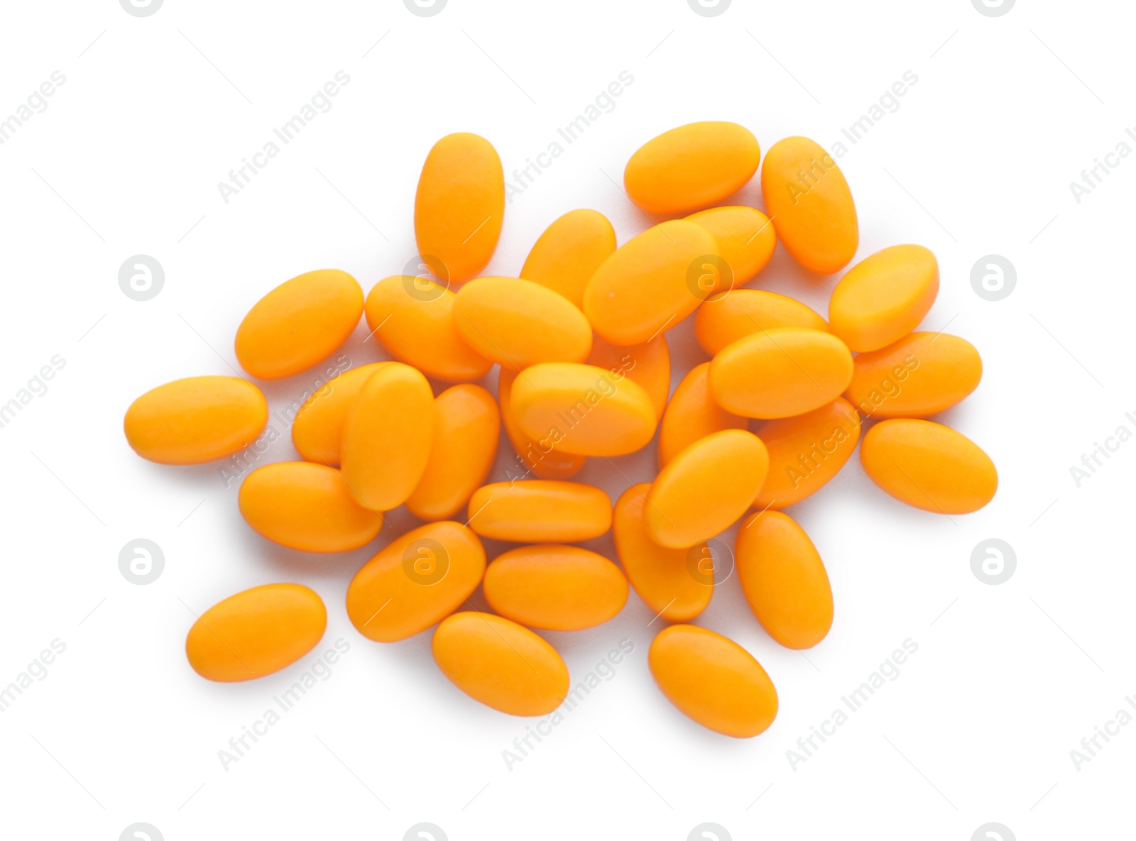 Photo of Tasty orange dragee candies on white background, top view