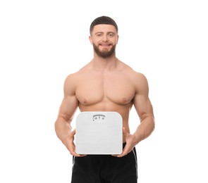 Portrait of happy athletic man with scales on white background. Weight loss concept