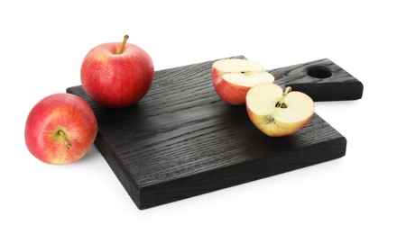 Photo of Black cutting board with fresh apples isolated on white