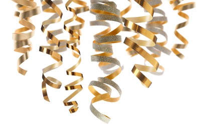 Many golden serpentine streamers on white background. Party decor