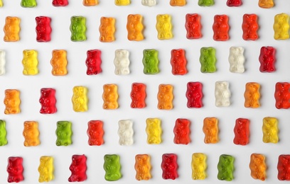 Delicious color jelly bears on white background, top view