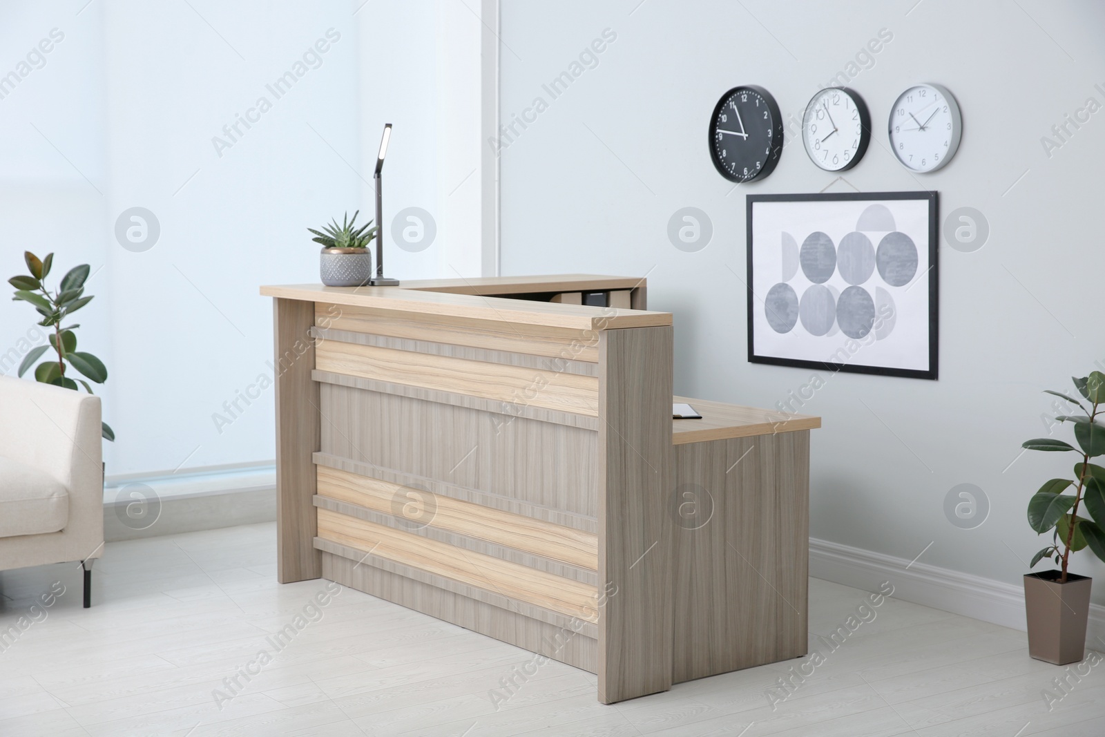 Photo of Lobby interior with stylish wooden receptionist desk