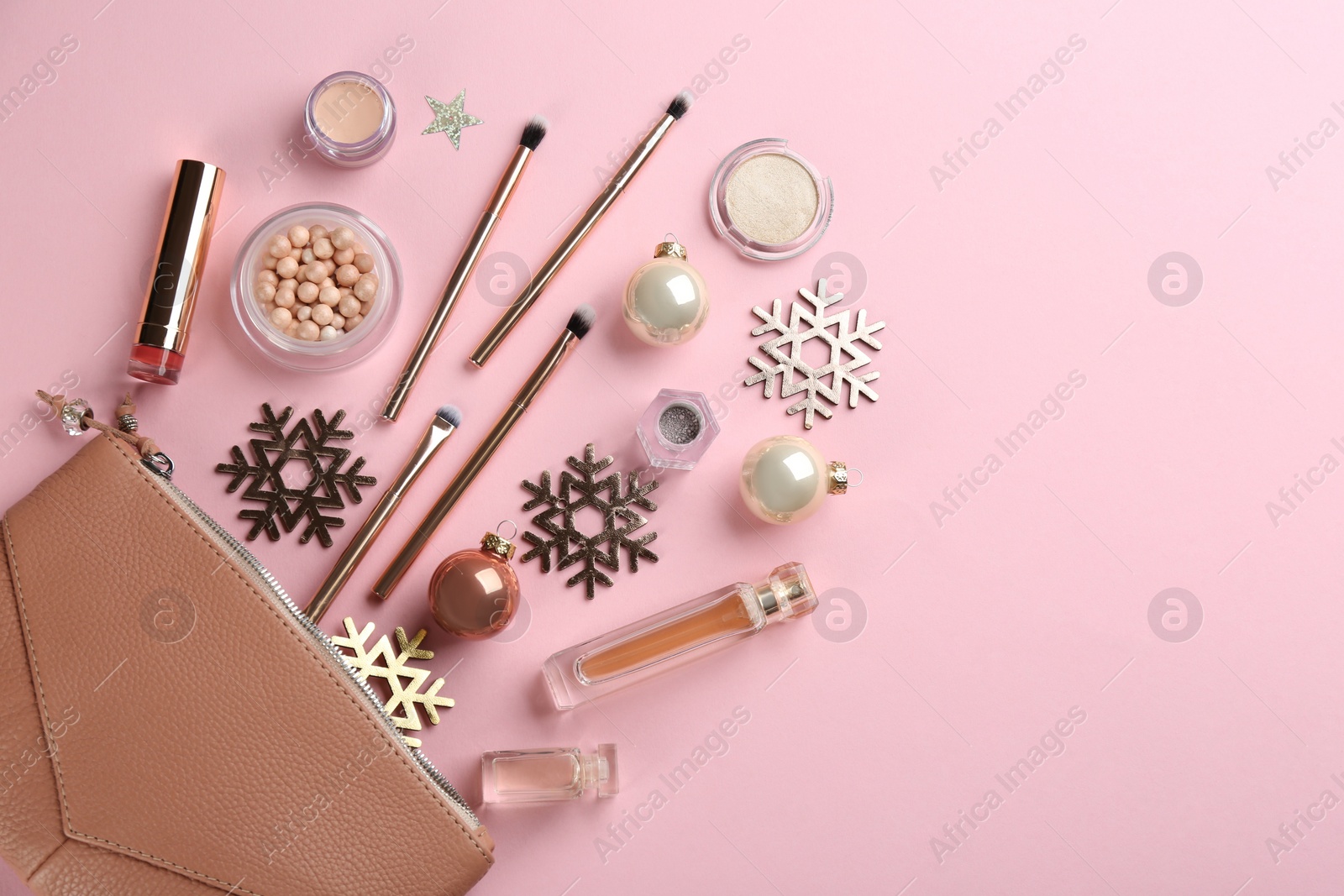 Photo of Flat lay composition with decorative cosmetic products on pink background. Winter care